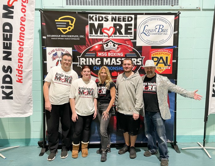 Kids Need More Volunteers Raymond Reed, Alyssa Roesch, Tina Adamo and Paulie Roesch Kids with Need More Founder Johnny Ray at the Freeport PAL's Ring Masters Tournament.