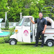 Rob Pellegrino, the founder of unique dining pop-up Pizza Passeggio, poses with his small-but-mighty pizza oven on wheels.