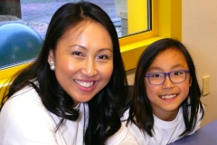 Founder of the Champskid program poses with her inspired daughter (lt to rt) Fenella Kim and Allena Kim.